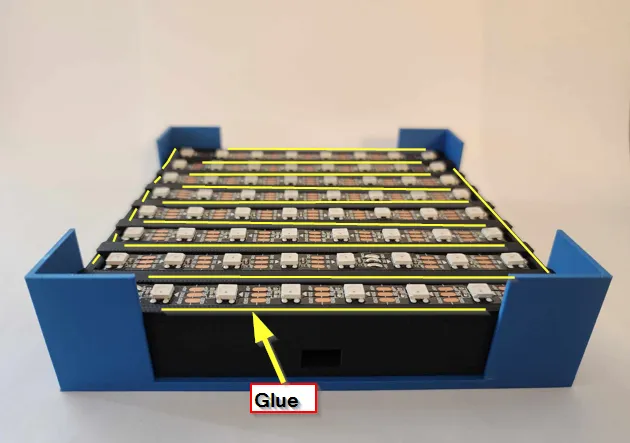 A blue box with many small white and yellow objectsDescription automatically generated with medium confidence