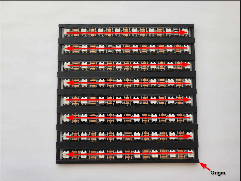 A black rectangular object with red and white buttonsDescription automatically generated