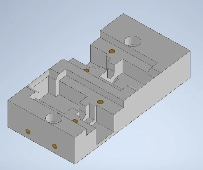A grey rectangular object with holesDescription automatically generated