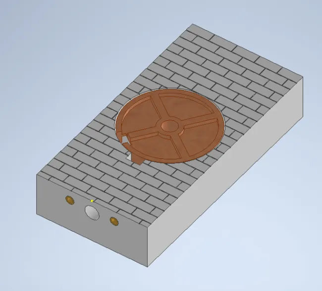 A grey rectangular object with a round object on topDescription automatically generated