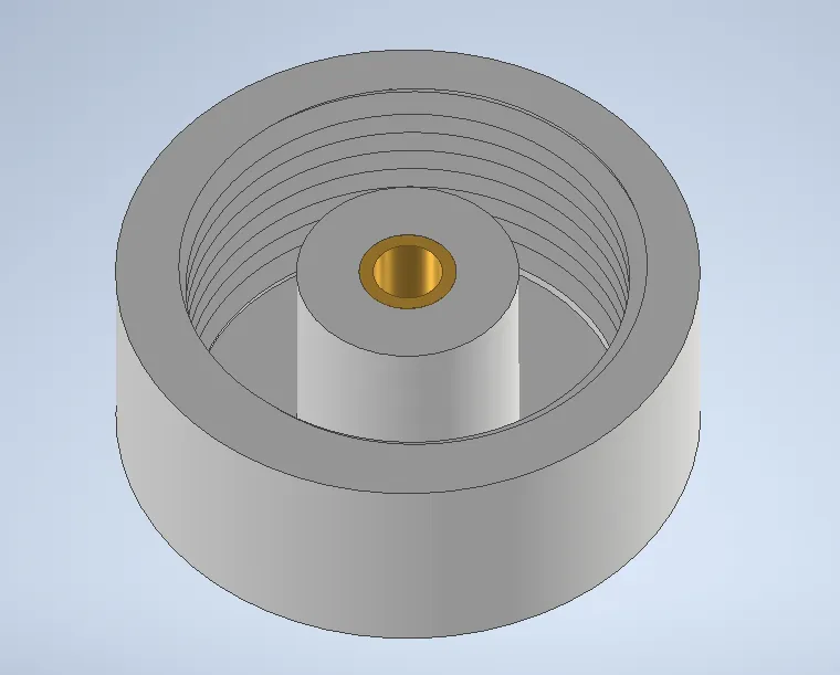A circular object with a hole in itDescription automatically generated