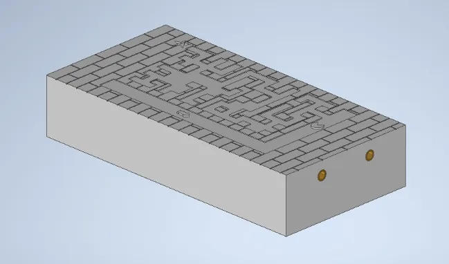 A white rectangular object with a maze patternDescription automatically generated