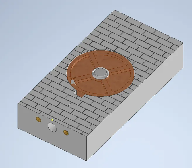 A grey rectangular object with a round object on topDescription automatically generated