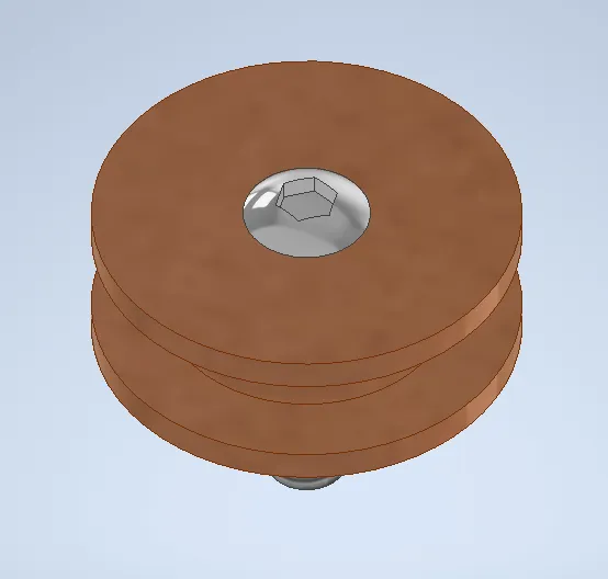 A brown object with a nut in the centerDescription automatically generated