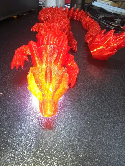 Articulated flexi dragon fire - Free 3D Print Model - MakerWorld