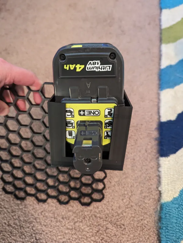 Support batterie Ryobi pour mur nid d'abeille