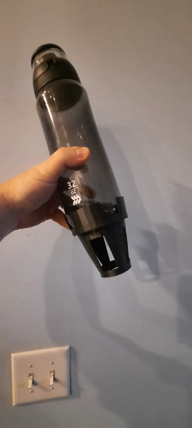 Cup holder expansion for Yeti Mugs and large water bottles.