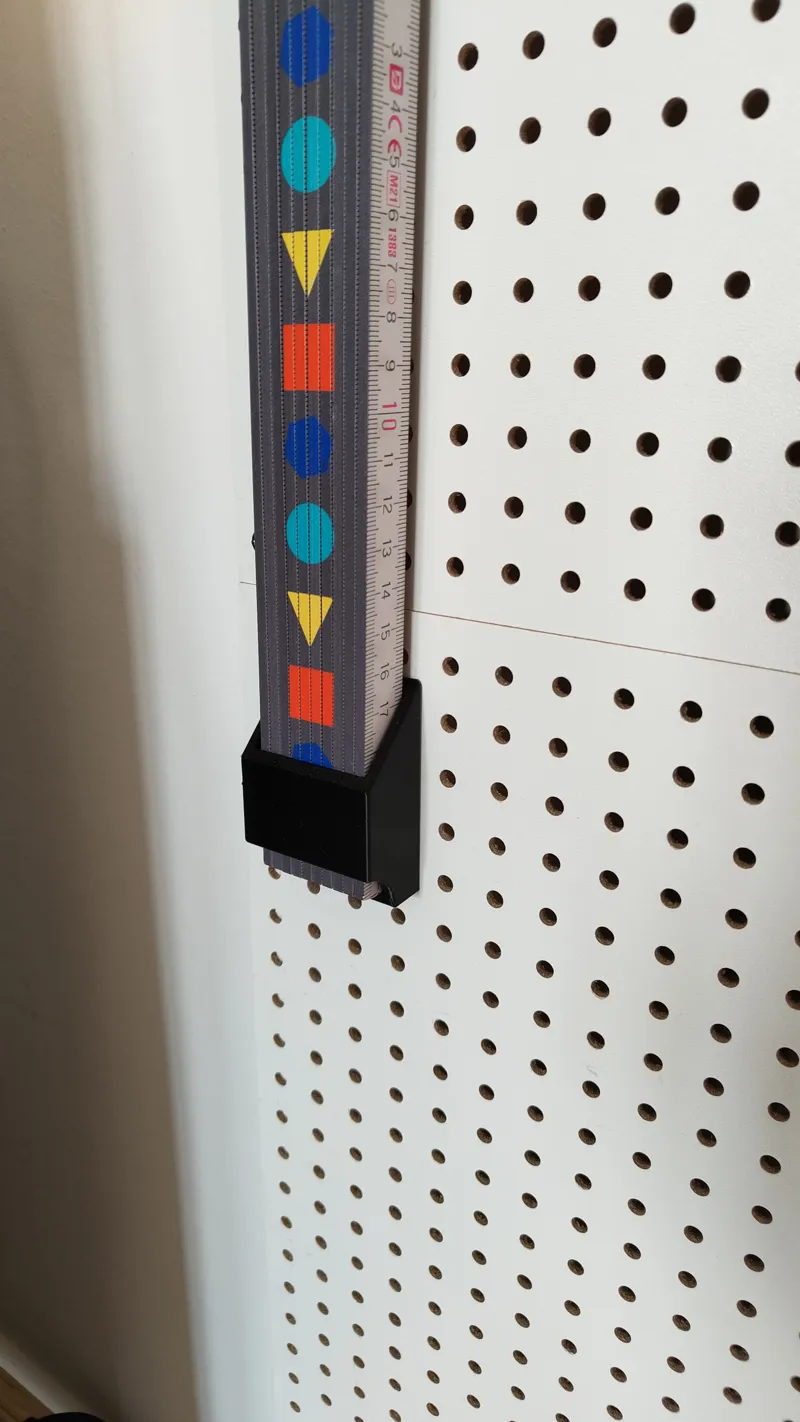 Folding Ruler Holder for Metric Pegboards