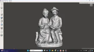 Antique figure - an old couple on a bench