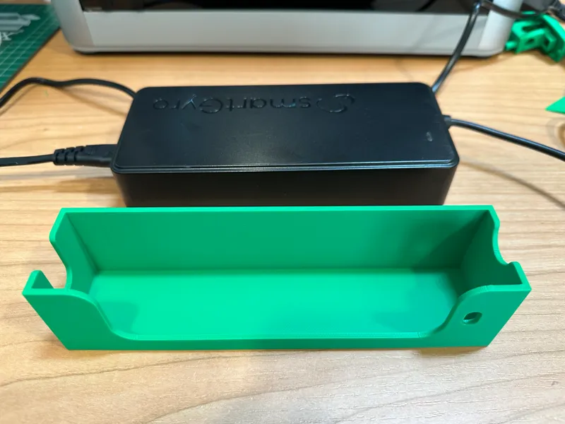 Wall mount for SmartGyro electric scooter power adapter.