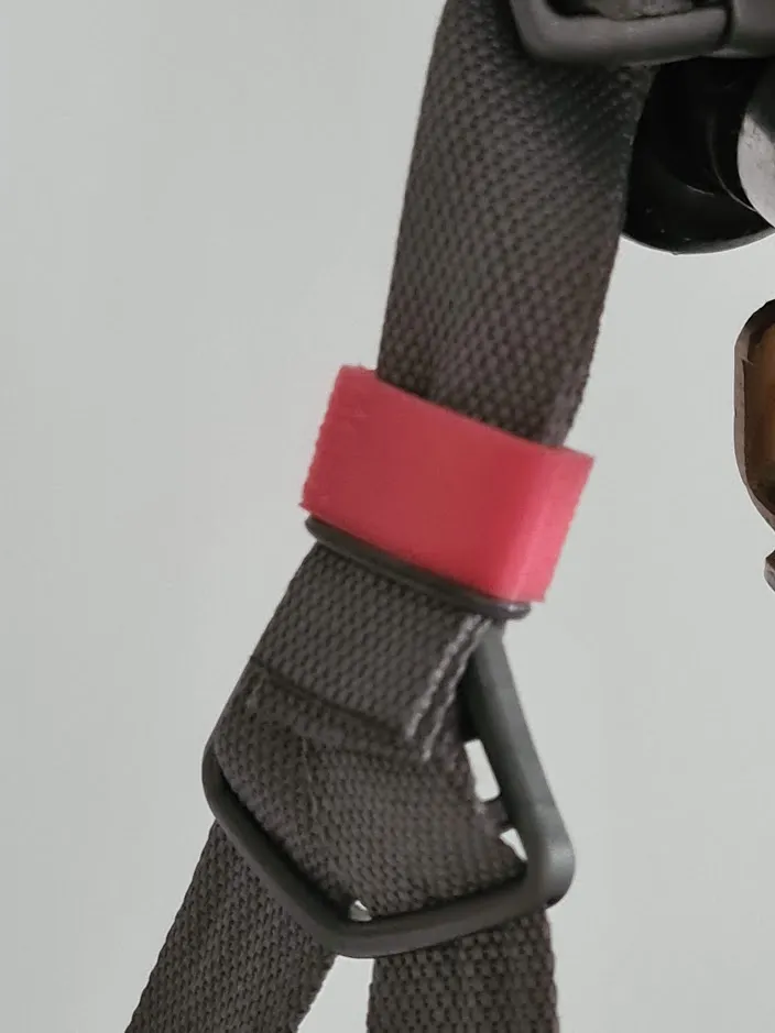 Bicycle helmet strap holder