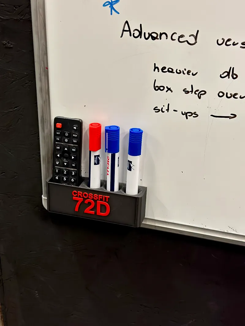 White board marker holder plus rogue remote control + magnetic