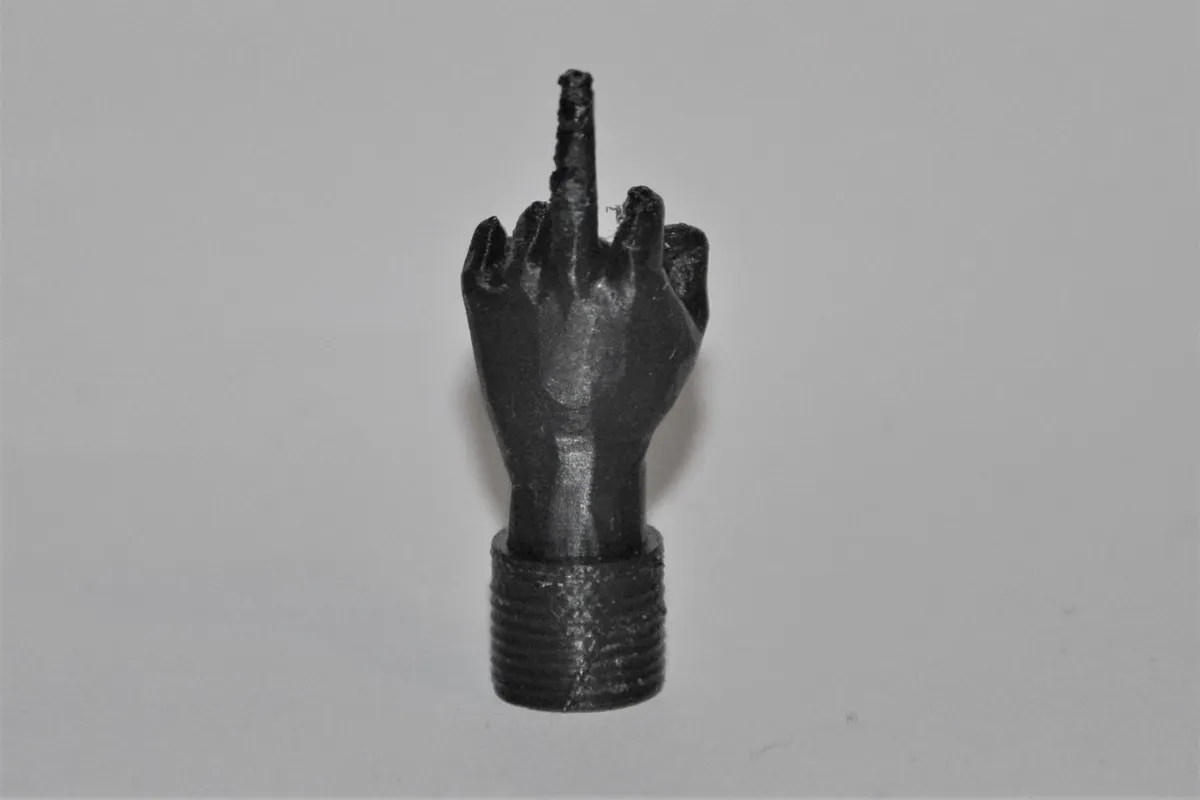 Bouchon de valve doigt d'honneur
