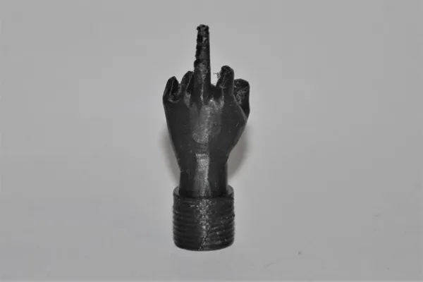 Bouchon de valve doigt d'honneur