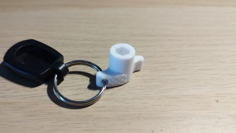 Bit driver with relief cutouts and keyring hole