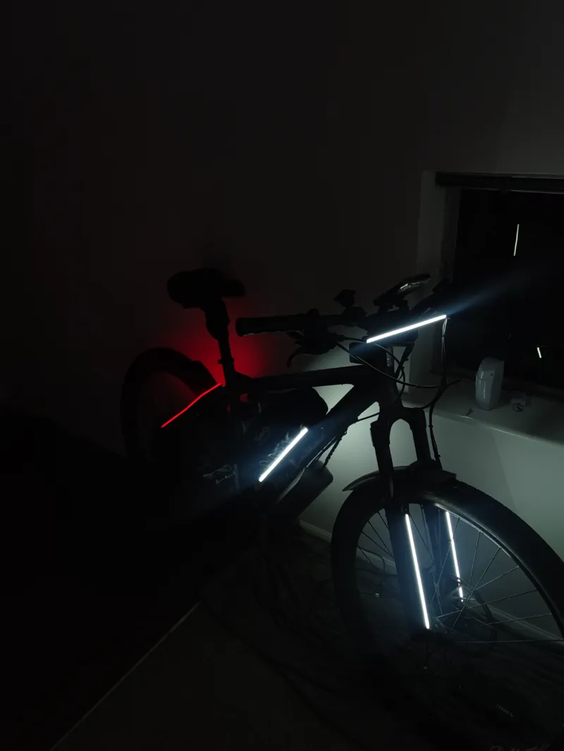 Box assembly to house wiring and power bank that powers neon bike lighting 