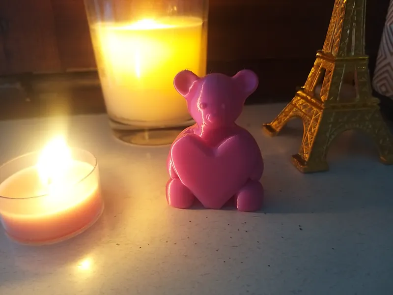 Teddy holding a heart