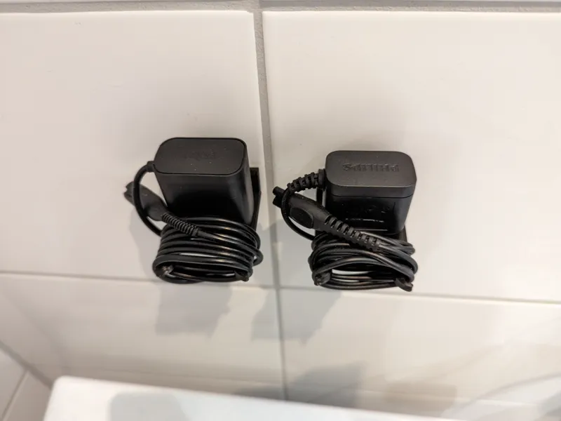 Power adapter wall holder