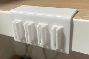 Cable holder for Ikea desk