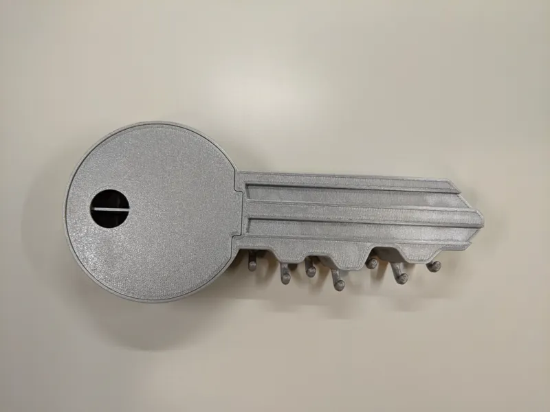 Key shaped keyholder - wall mountable