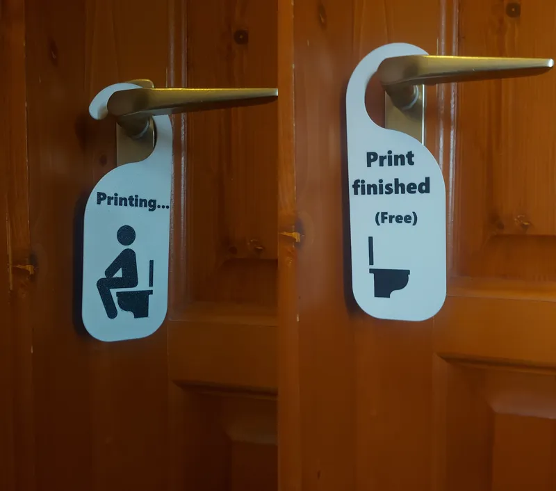 Toilet door hanger