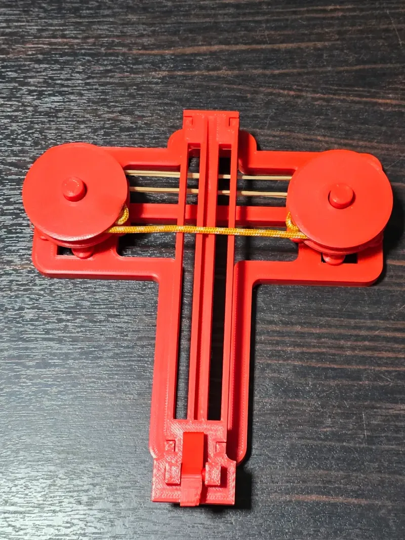 Rubber band paper plane launcher