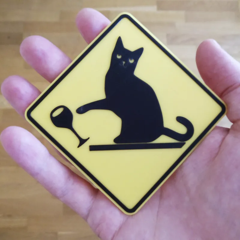 Cat knocking down stuff warning sign