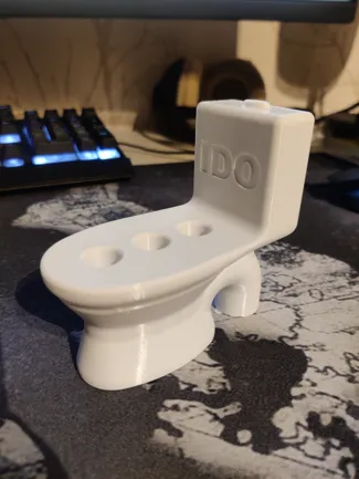 Toiletbowl tootbrush holder