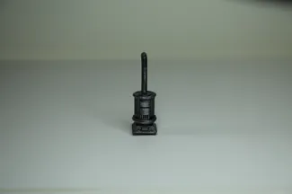 miniature cast iron stove with pipe