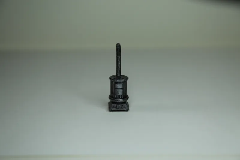 miniature cast iron stove with pipe