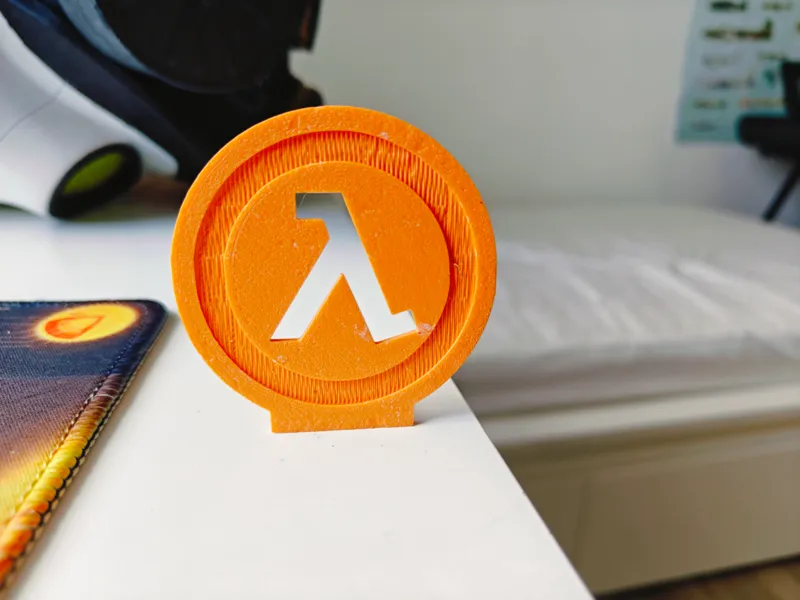 Lambda symbol desk toy