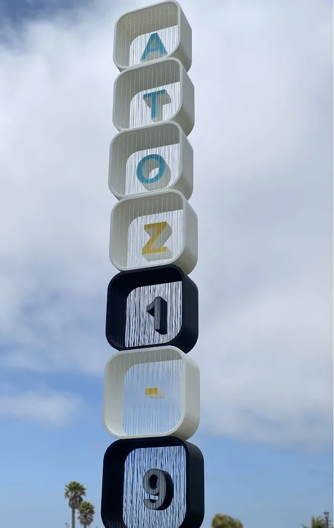 Customizeable suspended string art sign 