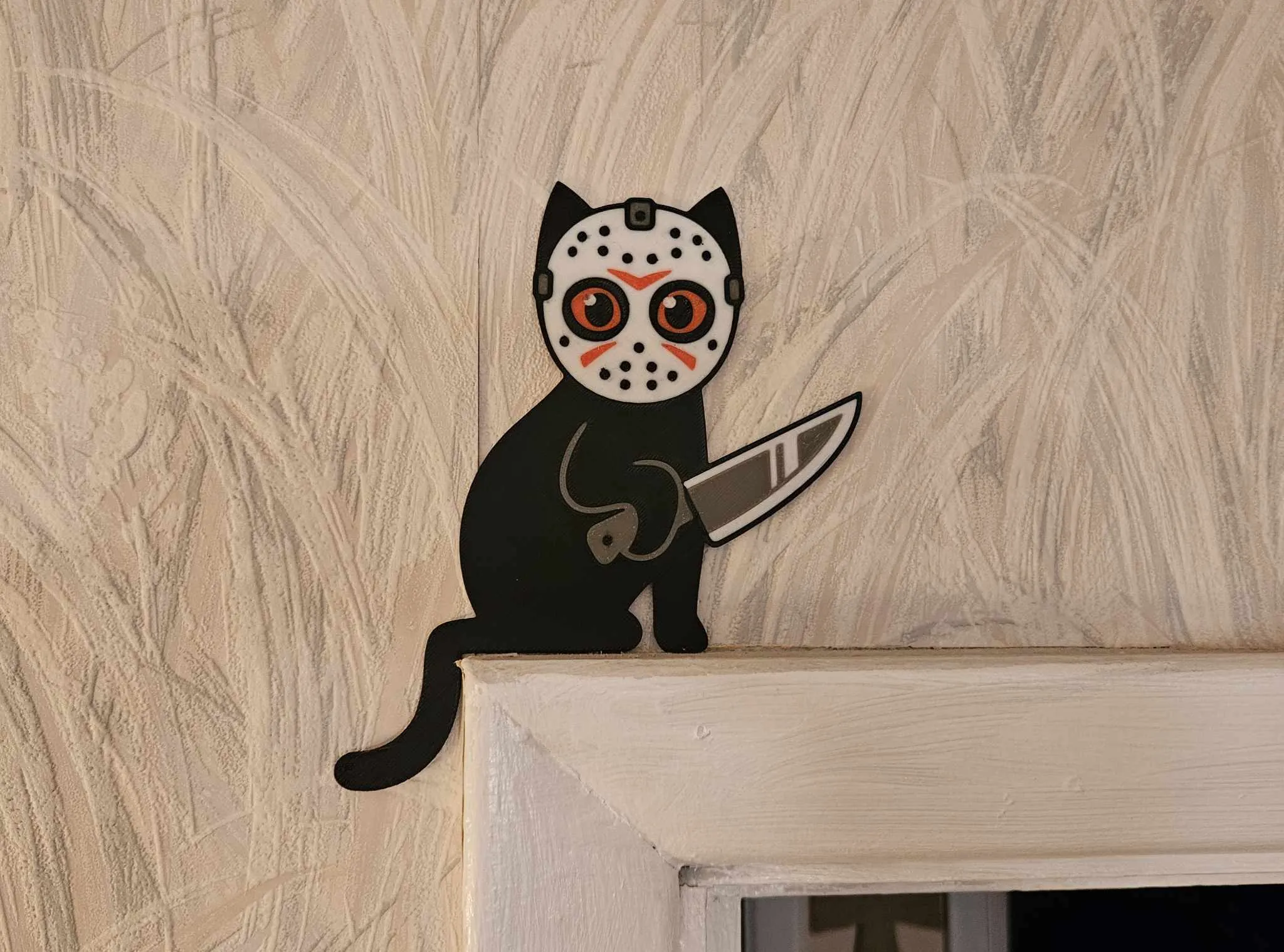 459372811_910106420960315_6224010581121802690_n.jpg Jason the Knife Cat Door Topper