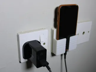 Phone holder in charger