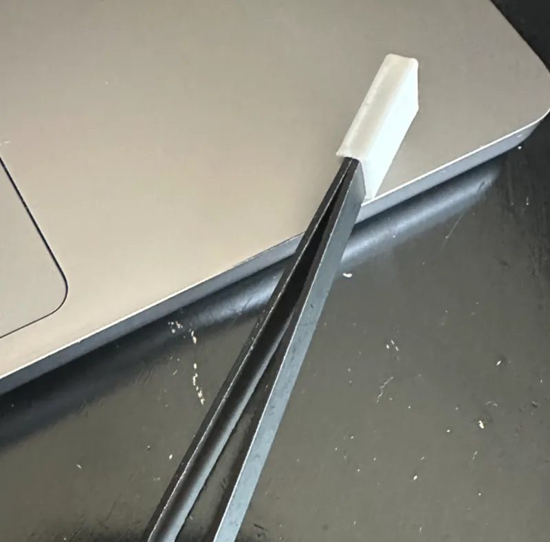 Tweezer holder for surgical precision tweezers