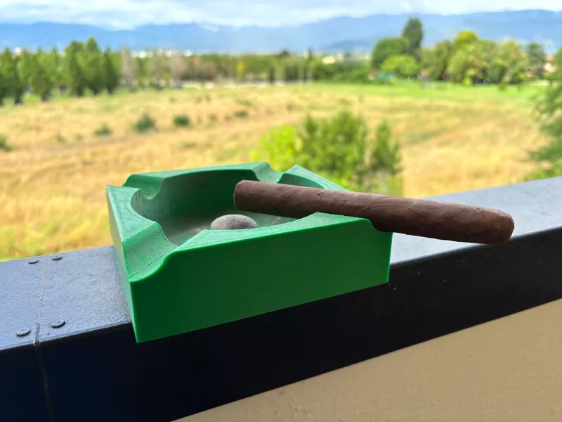 Ashtray with cigar holder and pipe emptyer