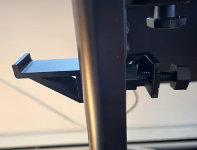 Side mounted headphone holder