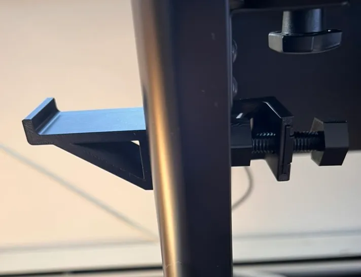 Side mounted headphone holder