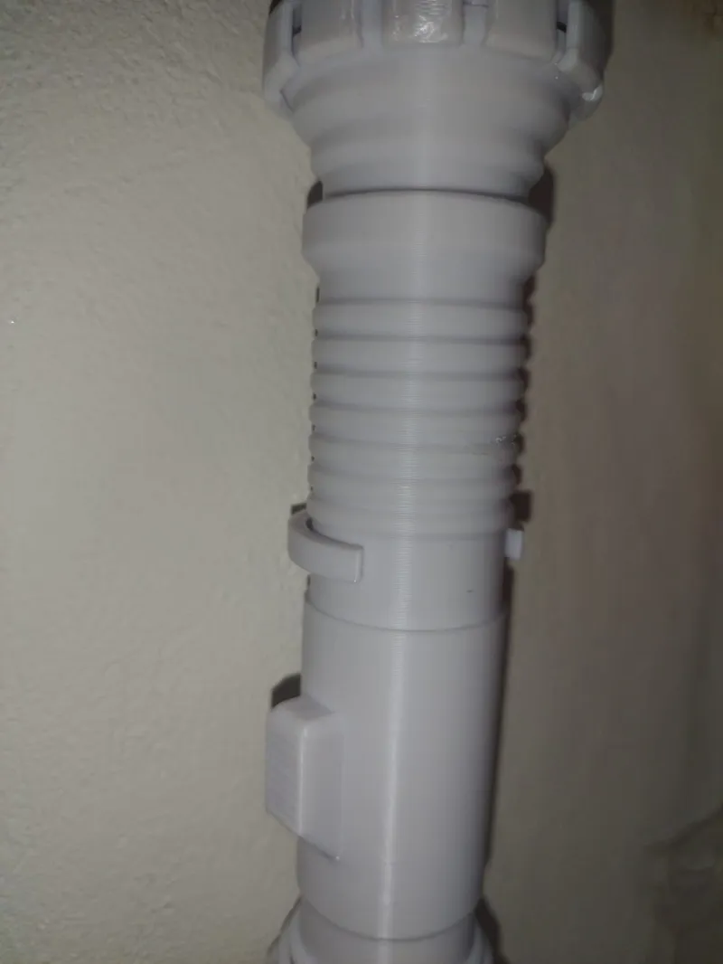 Wall holder for collapsible Lightsaber