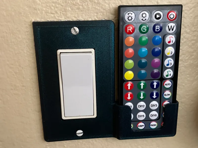 Light switch cover remote holder