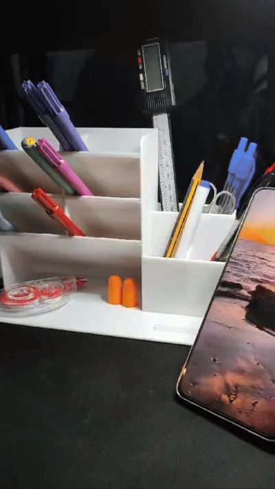 Pen with a holder for the mobile