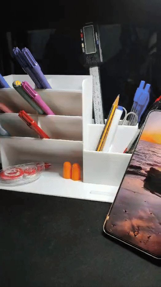 Pen with a holder for the mobile