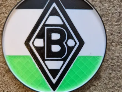 A glass coaster with Brussa logo