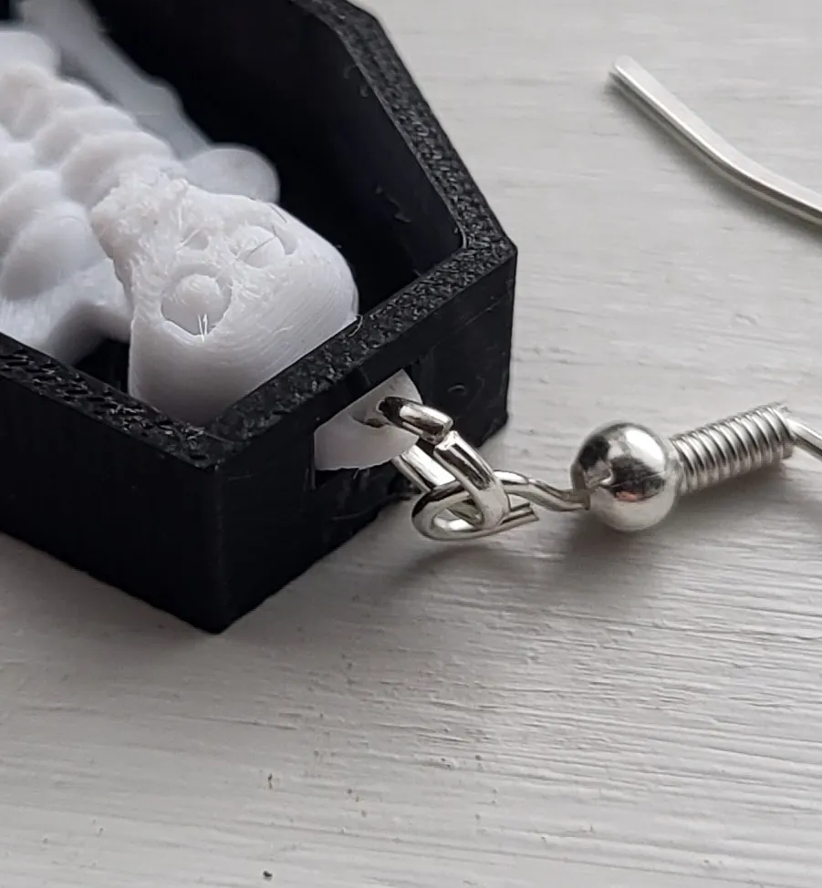 skeleton in coffin earring view 4