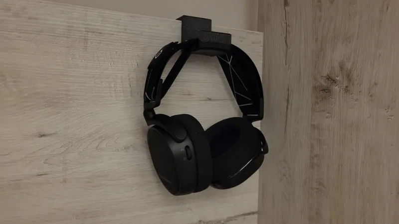 Headphones holder with a vertical hook
