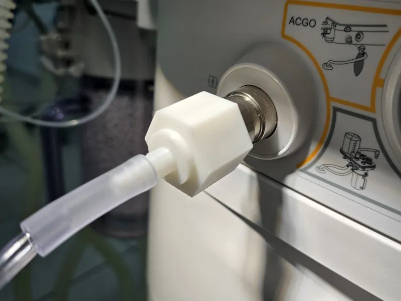 Anesthesia machine adapter for fresh gas outlet