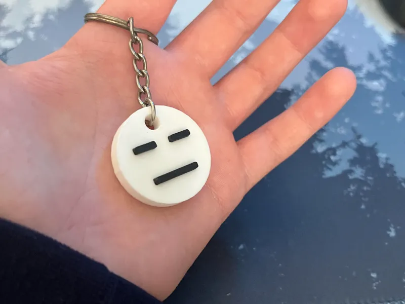 blank face emoji keychain 
