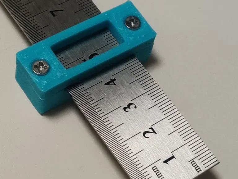 Block for fixing ruler scale