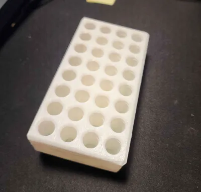 Wall mountable AAA battery holder