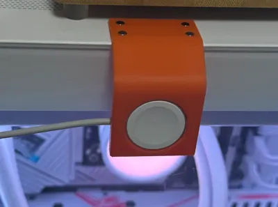 Apple Watch charging stand mounted on the computer case